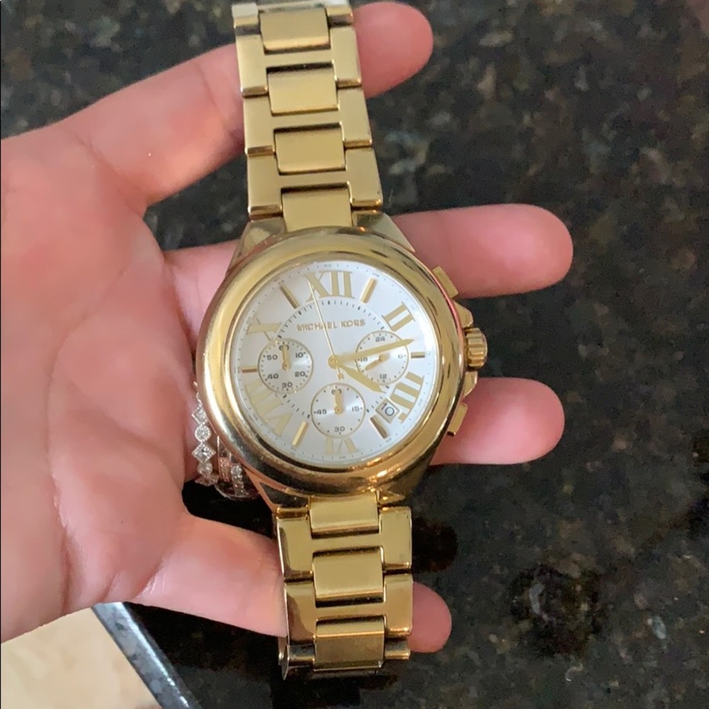Women’s MK gold watch medium size face
